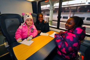 Emmah, Angel and Katie relax on the Acela.